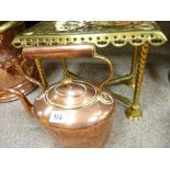 Antique copper kettle and brass trivet stand