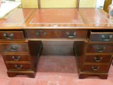 Reproduction twin pedestal desk with triple section tooled leather top