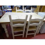 Pine farmhouse table with white painted legs and four rush seated chairs