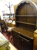 Polished wood Dutch style arched top compact dresser