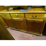 Pine sideboard of three drawers over three base cupboards