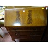 Polished wood three drawer writing bureau