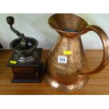 Beaten copper vintage water jug and a coffee grinder