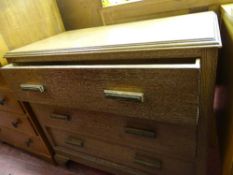 Polished wood three drawer chest with carved detail to handles