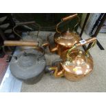 Four antique copper kettles