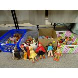 Four boxes of mainly wooden dolls and similar items