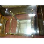 Bevelled glass topped ornate metal coffee table with undershelf