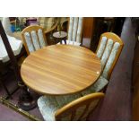 Modern circular drop leaf dining table and four chairs