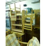 Modern light wood drop leaf dining table and four chairs together with a four shelf bookcase