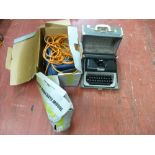 Challenge Extreme chainsaw, model no. SCS718A and a cased vintage typewriter E/T