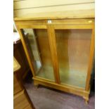 Modern light wood glazed two door display cabinet