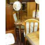 Polished wood tripod table with brass stem and circular bevelled edge tilting mirror