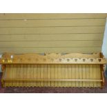 Pine two shelf wall hanging rack with heart shaped carvings