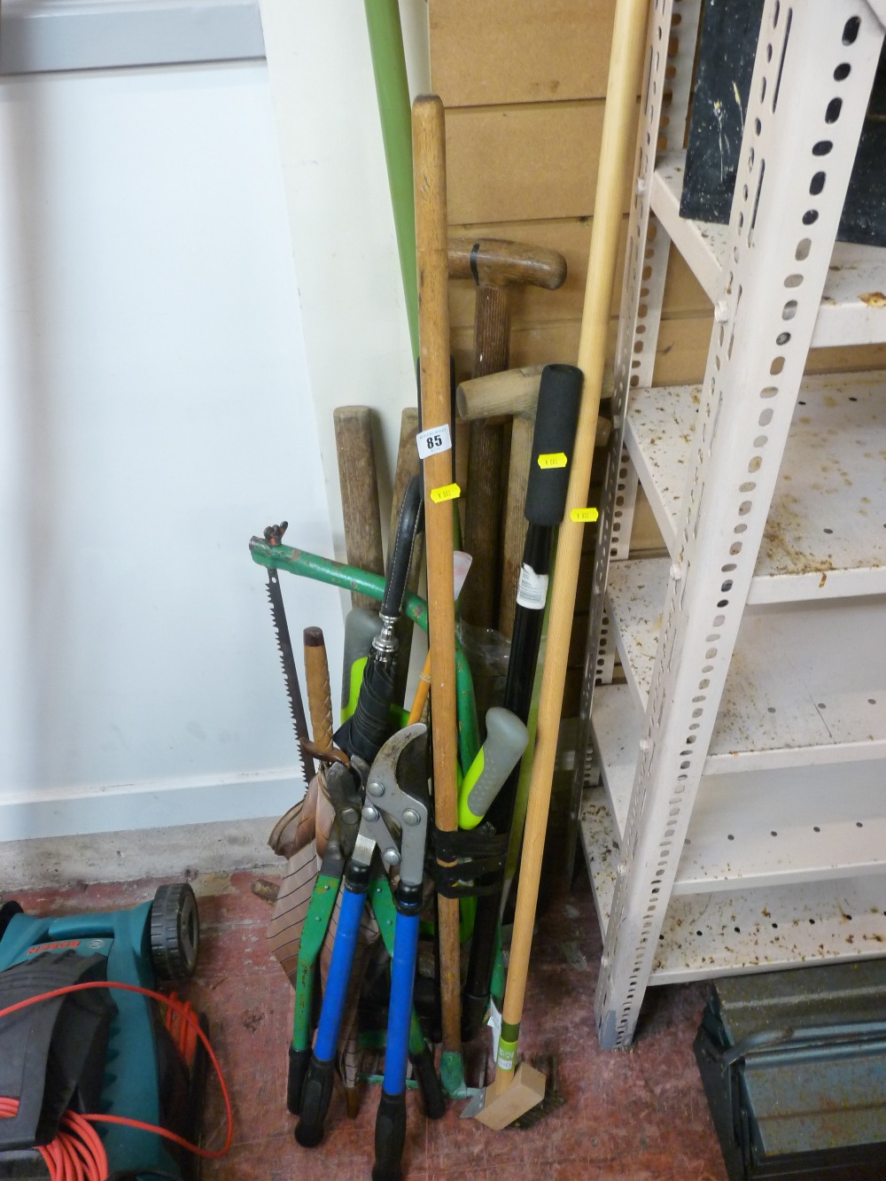 Parcel of long handled garden tools including shears, saws etc