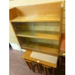 Mid Century nest of four tables and a three shelf bookcase with glazed sliding doors