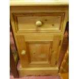 Small pine bedside cabinet with single drawer over a base cupboard
