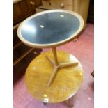 Small circular occasional table with black insert top and tripod feet designed by Hans C Andersen of