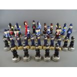 Large parcel of semi-glazed Laurel & Hardy and other comic figurines (chess set)