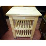 Modern butcher's block style kitchen work table with two slatted lower shelves