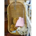 Hanging bamboo basket seat and contents of large soft toy, waffle blanket and rug