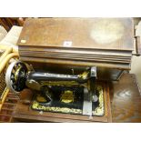 Wooden cased manual Singer sewing machine