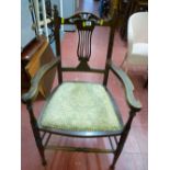 Polished wood elbow chair with upholstered seat having stud detail