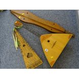 Three handmade primitive string musical instruments