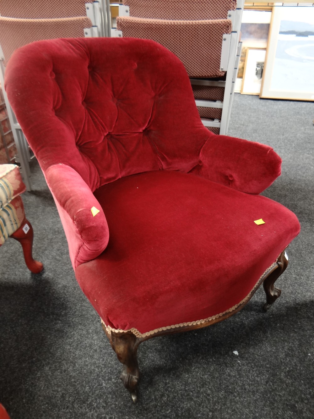 An antique buttoned velvet armchair Condition Report: please request* *Condition is not stated in