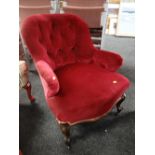 An antique buttoned velvet armchair Condition Report: please request* *Condition is not stated in