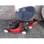 A Laser by Mountfield petrol lawn mower together with a selection of garden pots (outside) Condition