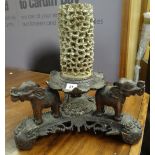 Carved Eastern design tri-form stand decorated with elephants & dragons below a lotus leaf having