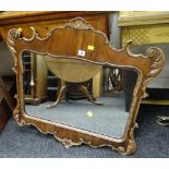 An antique gilded Rococo-style wooden mirror with shaped pane, 73cms high Condition Report: please