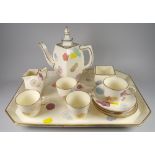 A rare British Victorian cream-ground pottery coffee-set comprising tray, coffee pot with lid, cream