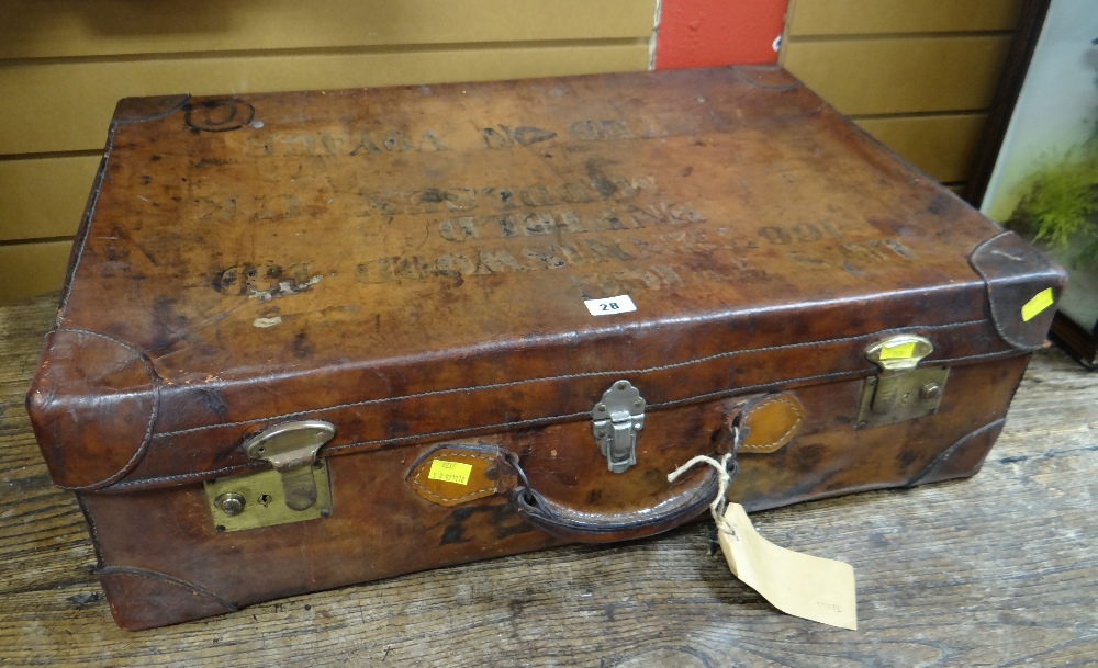 A good vintage carved calf-skin suitcase, the lid lettered for a Middlesex address Condition Report: