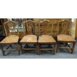 A set of four oak farmhouse chairs Condition Report: please request* *Condition is not stated in