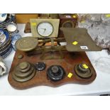 A large set of brass scales with weights on a mahogany base Condition Report: please request* *