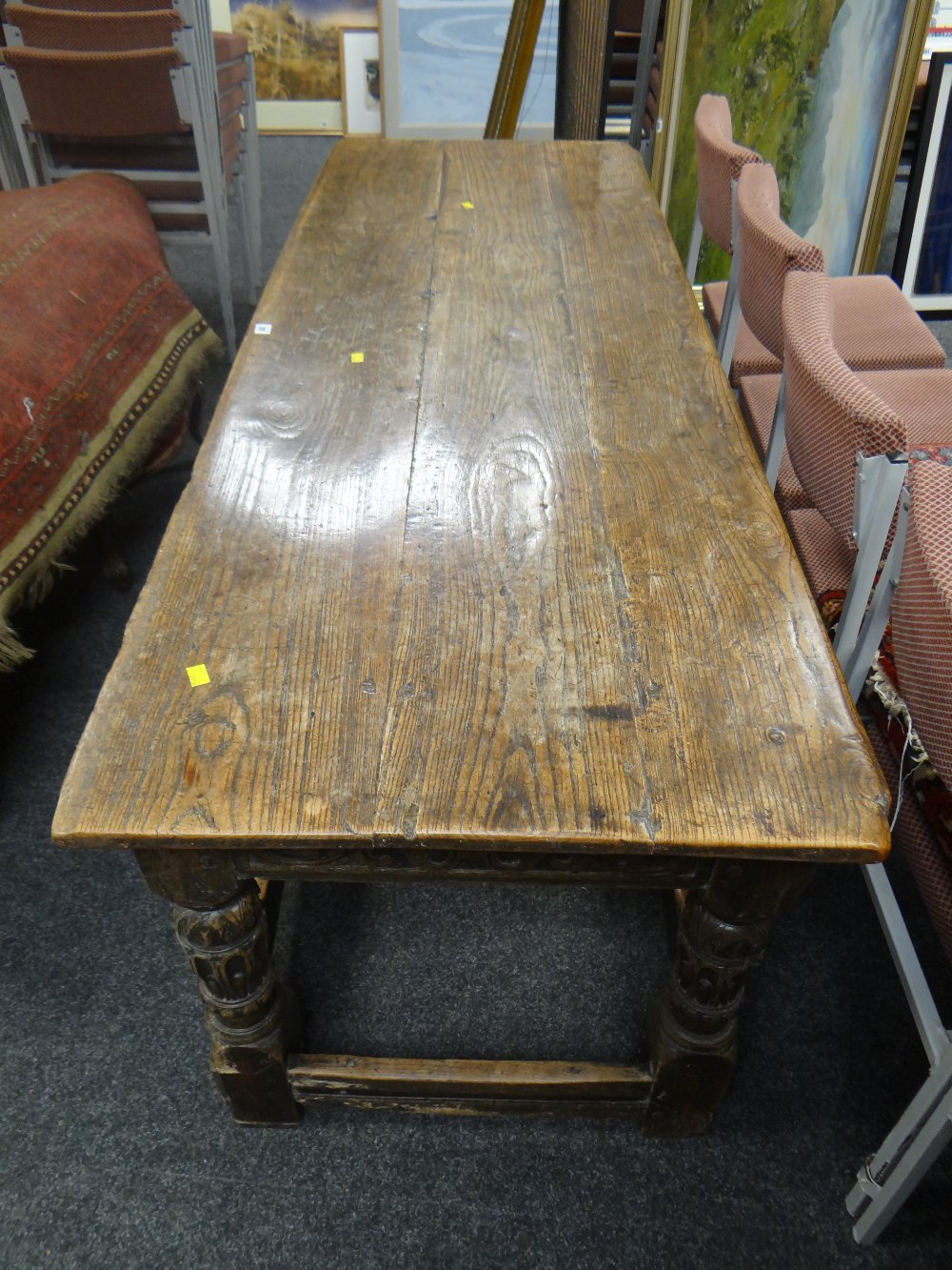 A believed eighteenth century carved oak refectory table, the top with three planks, carved frieze - Image 4 of 4