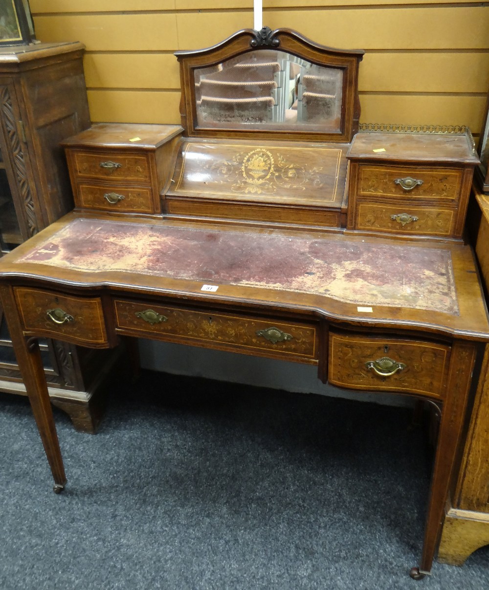 An antique rosewood writing desk by Maple & Co with marquetry serpentine covered stationary cabinet,