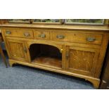 Early twentieth century oak dressing base having two long & one short drawer above open dog