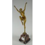 An early twentieth century polished bronze figure of a nude female dancer, circa 1920s, signed by