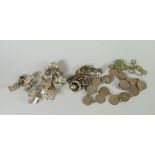 A parcel of silver charms & chains Condition Report: please request* *Condition is not stated in