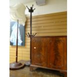 Twentieth century standard lamp on circular base together with mid-twentieth century coat stand &