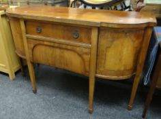 An antique inlaid mahogany breakfront sideboard composed of flanking cabinets & two centre