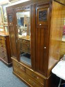 A vintage single door mirrored wardrobe with carved panels & three base drawers together with a pine
