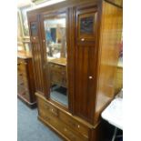 A vintage single door mirrored wardrobe with carved panels & three base drawers together with a pine