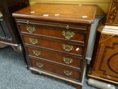 A reproduction chest of four graduated drawers & a pull out slide 73hx60wx38dcms. Condition