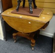 An antique mahogany drop-flap table with inlaid end drawer, dummy drawer over a shaped base on