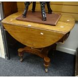An antique mahogany drop-flap table with inlaid end drawer, dummy drawer over a shaped base on
