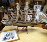 A model of a clipper sailing vessel the 'Archibald Russell' on wooden stand, 80cms long. Condition