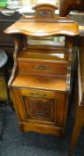 Early twentieth century carved pedonium coal box with mirror back above single drawer above full